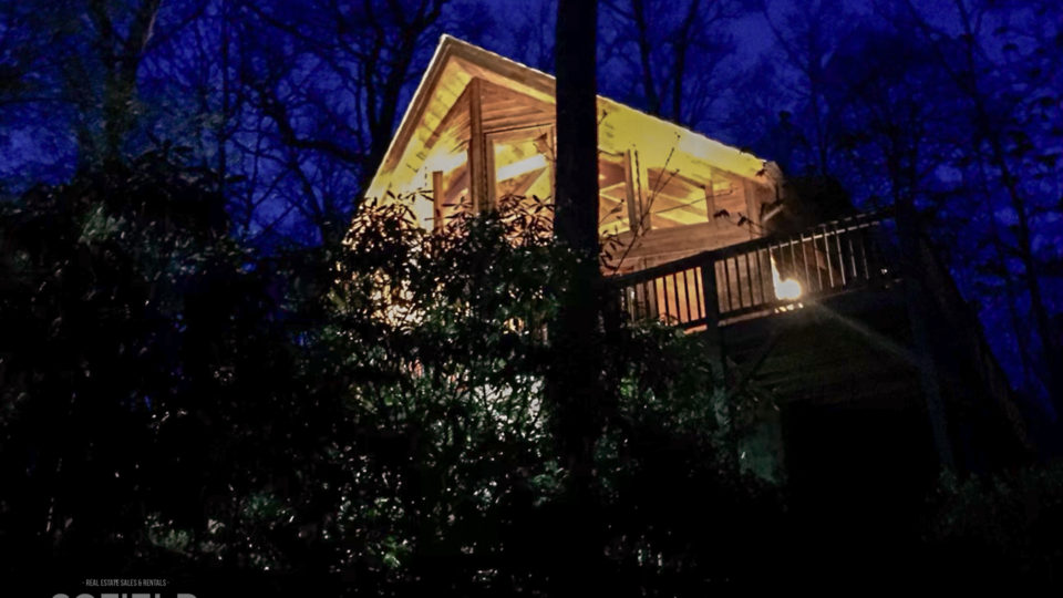 Cathedral Ceiling Mountain Cabin at night.